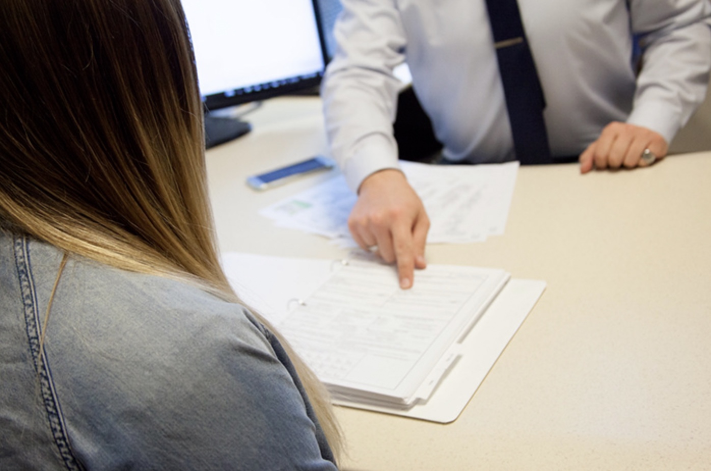 Serviceman Explaining Services to Client